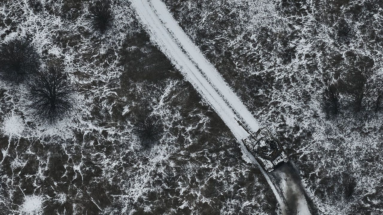 An aerial view of a tank on the move along snowy terrain in the Bakhmut district of Ukraine on December 8, 2023.