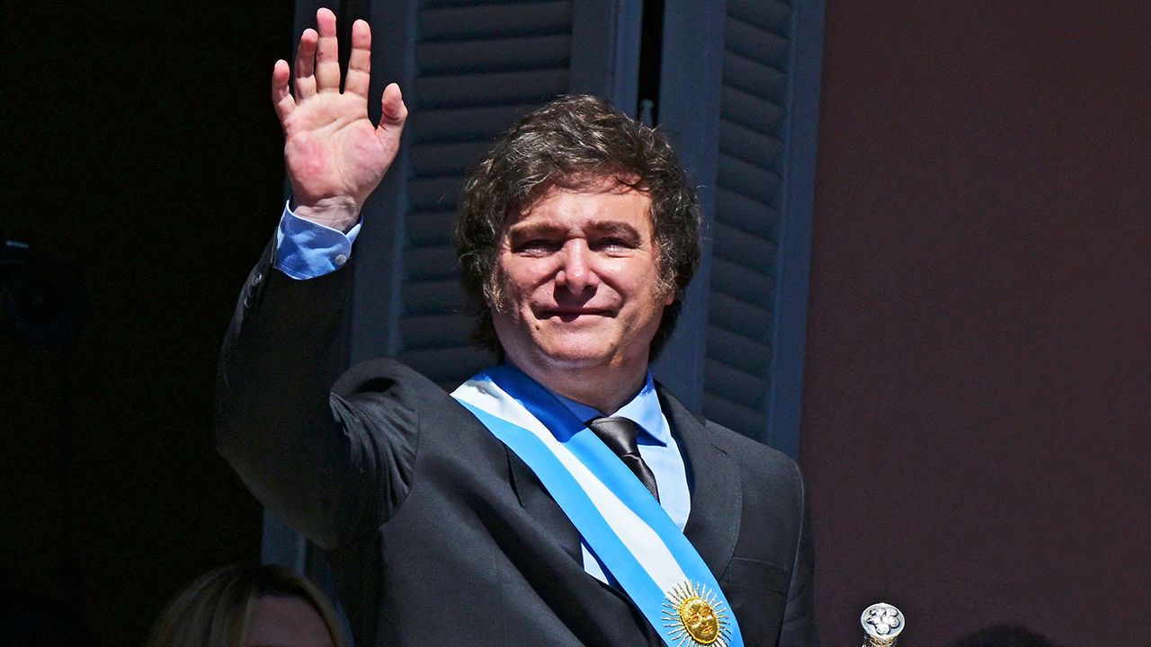 Javier Milei waves at the crowd from a balcony during his inauguration day in Buenos Aires on December 10th 2023