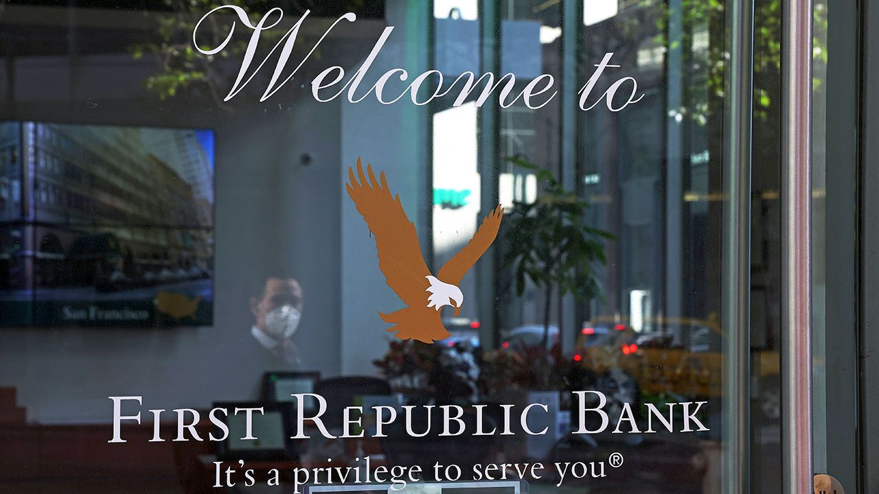 A pedestrian walks by a First Republic bank in San Francisco, California